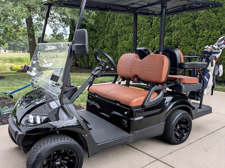 A lithium-converted golf cart in the driveway