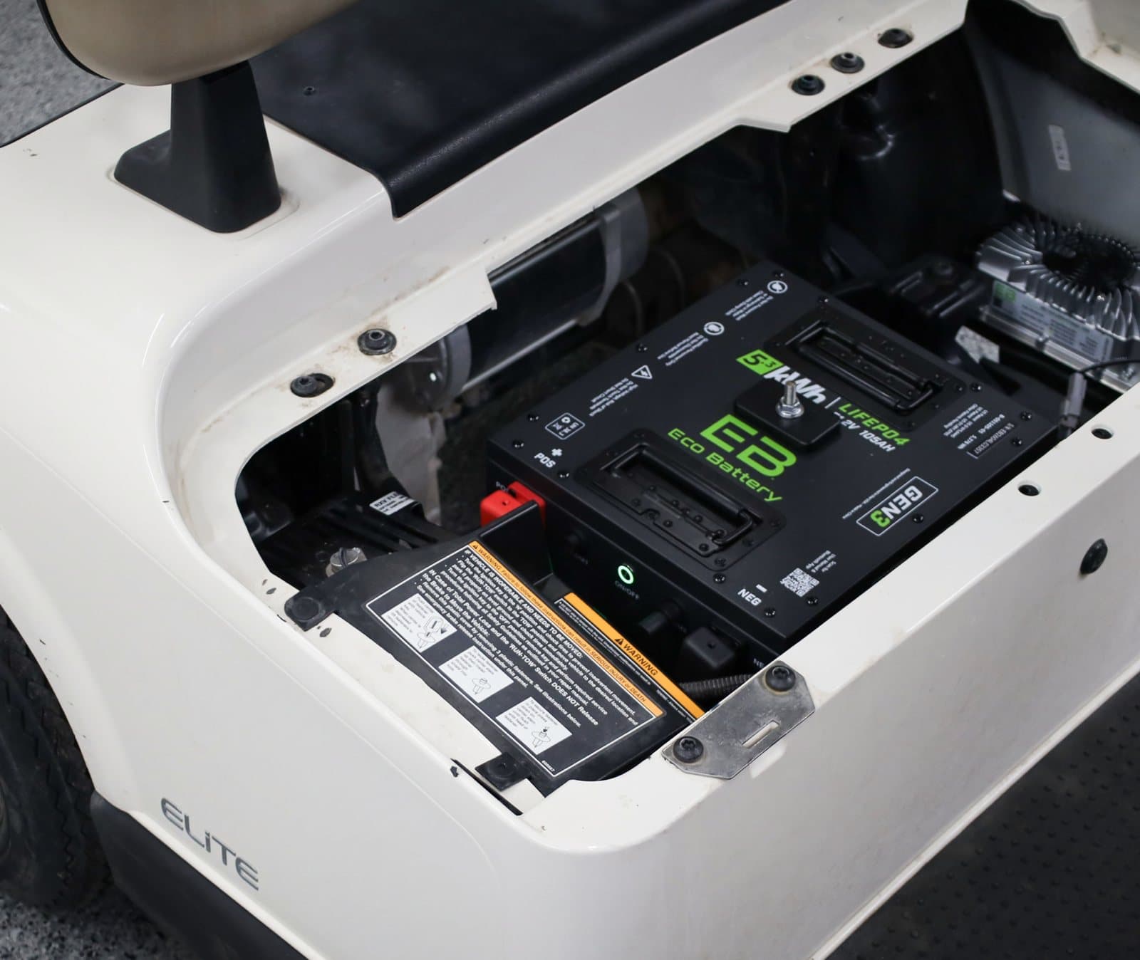 ECO Battery lithium pack installed under a golf cart seat