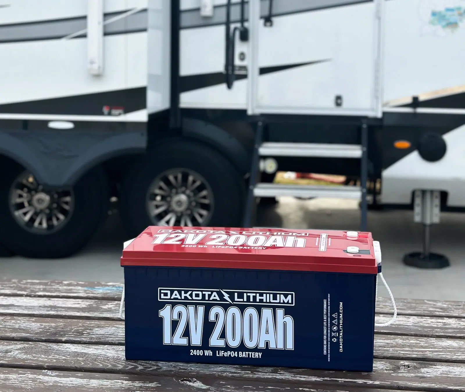 Dakota Lithium 12V 200Ah battery in front of an RV